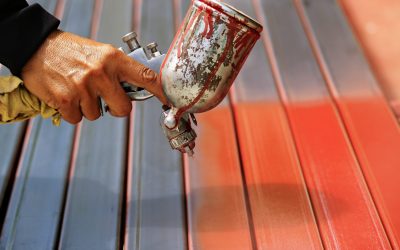 People are working with spray paint to prevent rust.