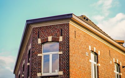 A low angle shot of an apartment building under the sunlight at daytime