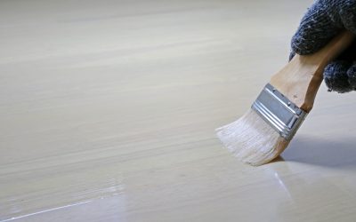 painter-hand-worker-use-brush-color-paint-wooden-background