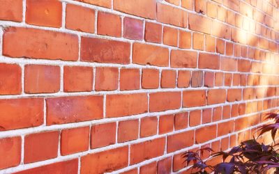A photo of a very old brick wall.